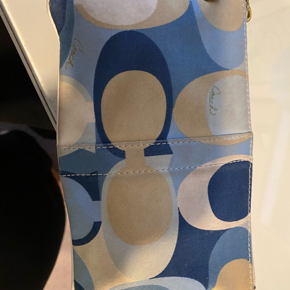 Blue and white Coach wristlet